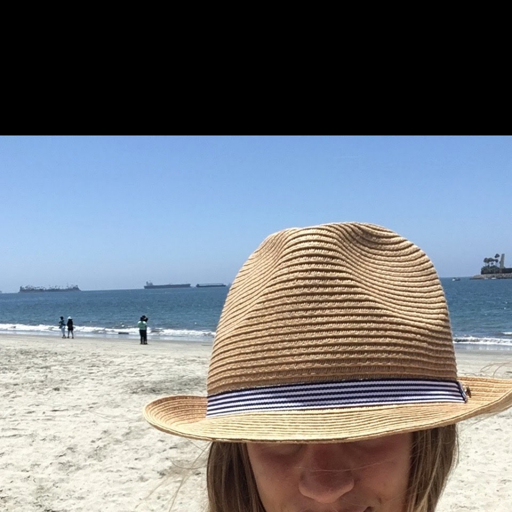 Stylish Tan Straw Hat with Blue Ribbon